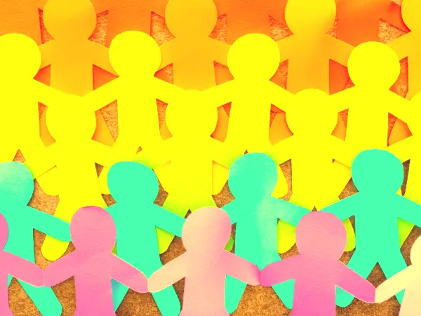 Multicolored paper cutouts of people.